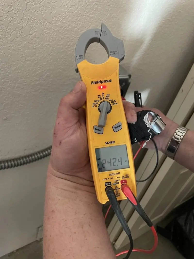 Voltage testing with clamp meter during Recessed Lighting Installation in Barrington